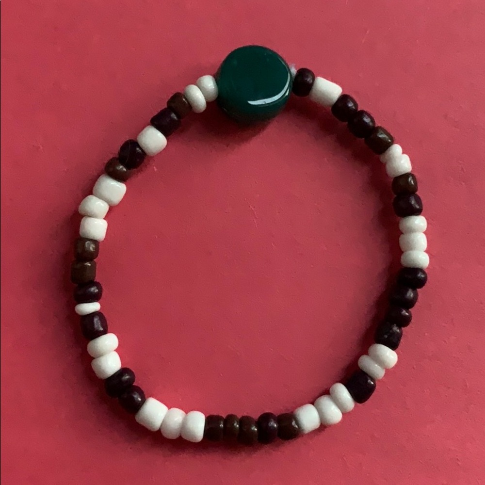 green/purple/white bracelet